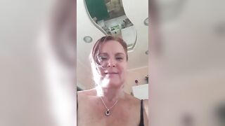 Desiderame mature busty lady in a short black dress and stockings masturbates her pussy with a pink vibrator 2019-08-08 12:00