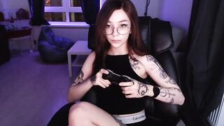Moonless cute tattooed girl in round glasses lifts up a black t-shirt and shows her beautiful tits 2020-01-30 15:35